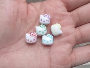 Entremeio gatinha 11mm em pastico (pct c/5 und misto)